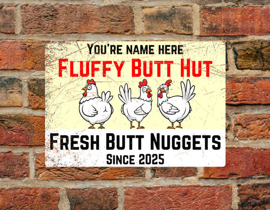 Personalised chicken coop sign 'Fluffy Butt Hut' in A4 aluminium with cartoon chickens and text 'Fresh Butt Nuggets Since 2025'. Weatherproof and ideal for outdoor use.
