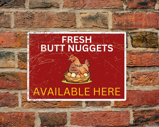 Fresh butt nuggets available here A4 aluminium sign mounted on brick wall, featuring a hen sitting on eggs. Ideal for egg sellers and farm signage.