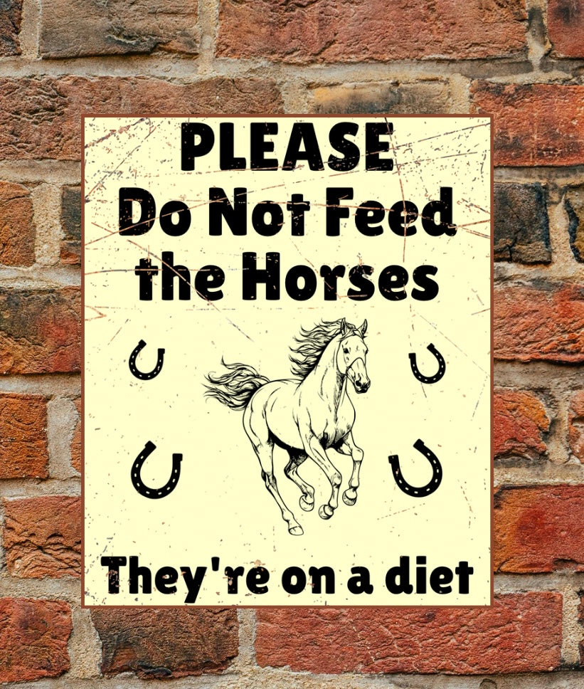 Please do not feed the Horses aluminium sign in A4 size mounted on a brick wall. Features bold black text, a galloping horse, and horseshoe graphics.