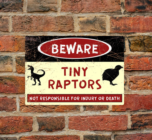 Tiny Raptors Quail Warning Sign in A4 aluminum mounted on a brick wall. Features bold 'Beware' text with quail and raptor silhouettes for safety alerts.
